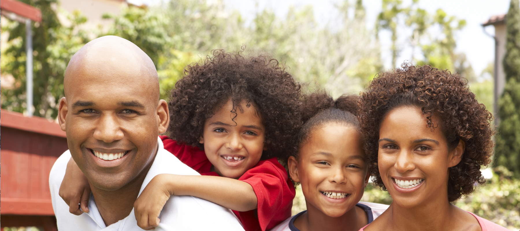 Family in front of new house